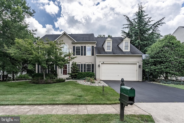 12655 Arthur Graves Jr Ct, Bristow, VA 20136 - colonial-style house featuring asphalt driveway, a front yard, and an attached garage
