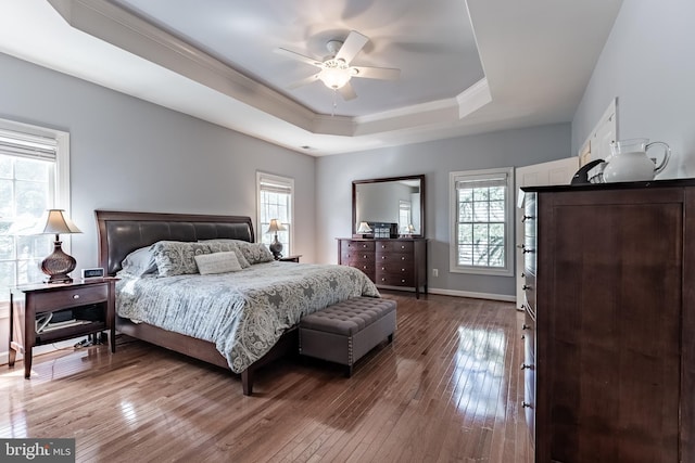 12655 Arthur Graves Jr Ct, Bristow, VA 20136 - bedroom featuring a tray ceiling, hardwood / wood-style floors, ornamental molding, and a ceiling fan
