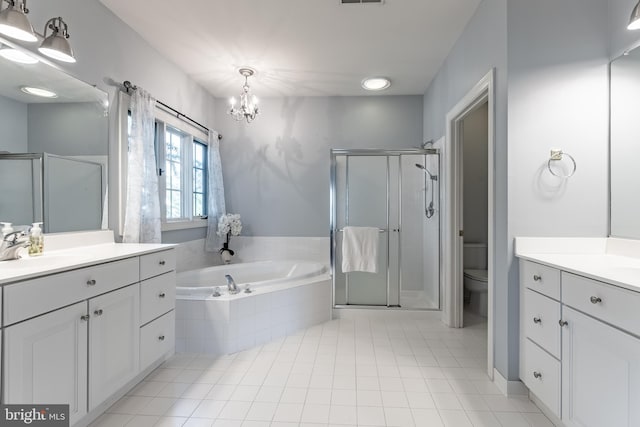 12655 Arthur Graves Jr Ct, Bristow, VA 20136 - full bathroom featuring vanity, a chandelier, a shower stall, and a garden tub