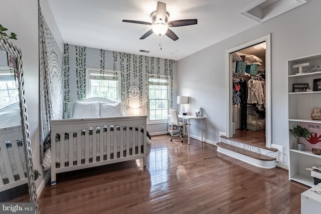 12655 Arthur Graves Jr Ct, Bristow, VA 20136 - bedroom featuring wood finished floors, a closet, an office area, a walk in closet, and a ceiling fan