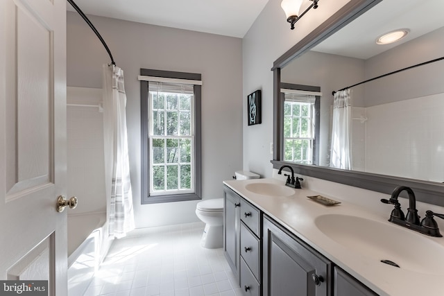 12655 Arthur Graves Jr Ct, Bristow, VA 20136 - bathroom with double vanity, shower / tub combo, and tile patterned flooring