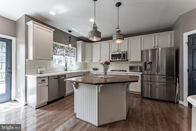 12655 Arthur Graves Jr Ct, Bristow, VA 20136 - kitchen featuring appliances with stainless steel finishes, wood counters, dark wood-style flooring, tasteful backsplash, and recessed lighting