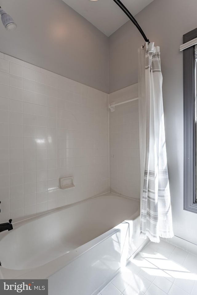 12655 Arthur Graves Jr Ct, Bristow, VA 20136 - bathroom with shower / bath combo with shower curtain and tile patterned floors
