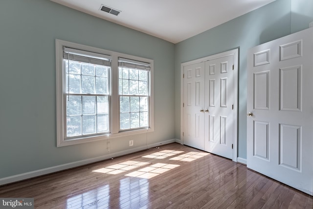 12655 Arthur Graves Jr Ct, Bristow, VA 20136 - unfurnished bedroom with wood finished floors and a closet