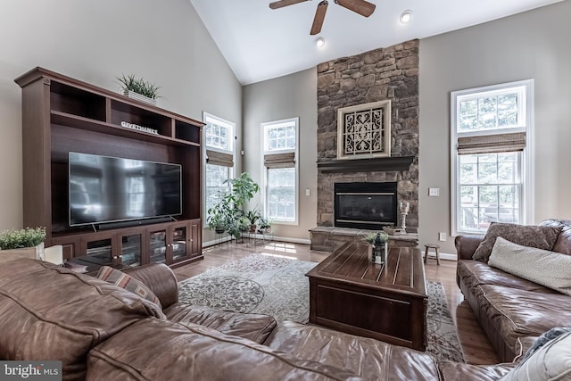 12655 Arthur Graves Jr Ct, Bristow, VA 20136 - living area with ceiling fan, a fireplace, wood finished floors, and high vaulted ceiling