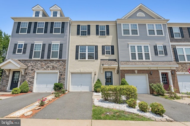 9924 Whitemoss Dr, Manassas, VA 20109 - multi unit property featuring a garage, driveway, and stone siding