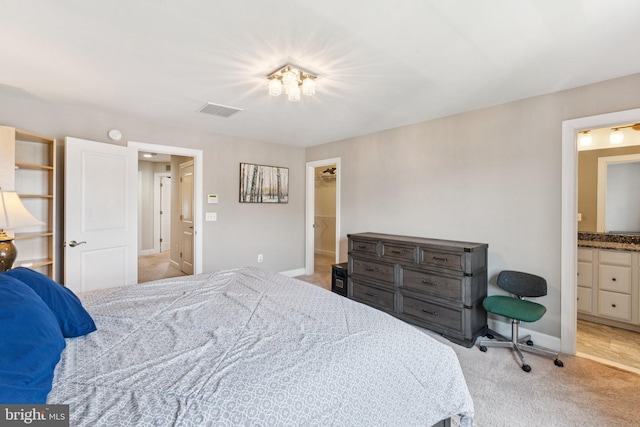9924 Whitemoss Dr, Manassas, VA 20109 - bedroom with light colored carpet, a walk in closet, and connected bathroom