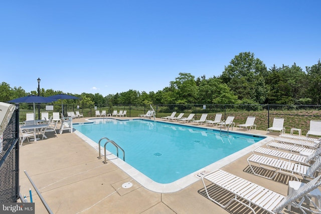 9924 Whitemoss Dr, Manassas, VA 20109 - community pool with a patio and view of scattered trees