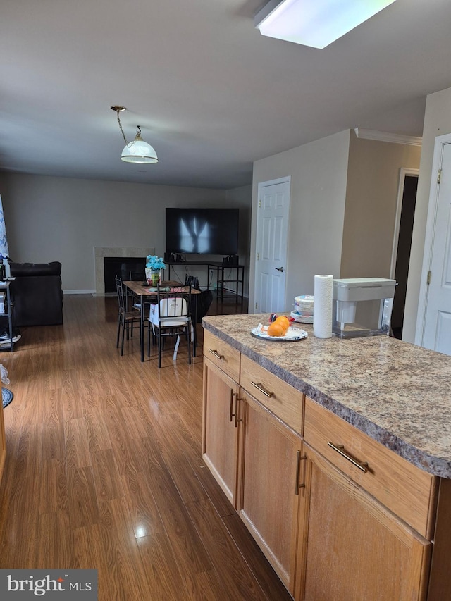 173 Ranson Estates Cir, Ranson, WV 25438 - kitchen with open floor plan, dark wood-type flooring, crown molding, and light countertops