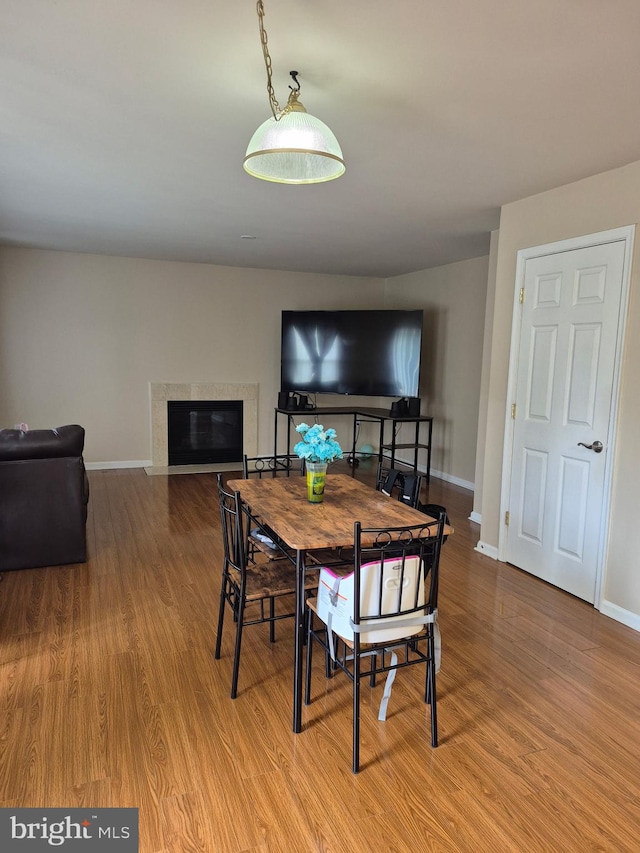 173 Ranson Estates Cir, Ranson, WV 25438 - dining space featuring wood finished floors and a high end fireplace
