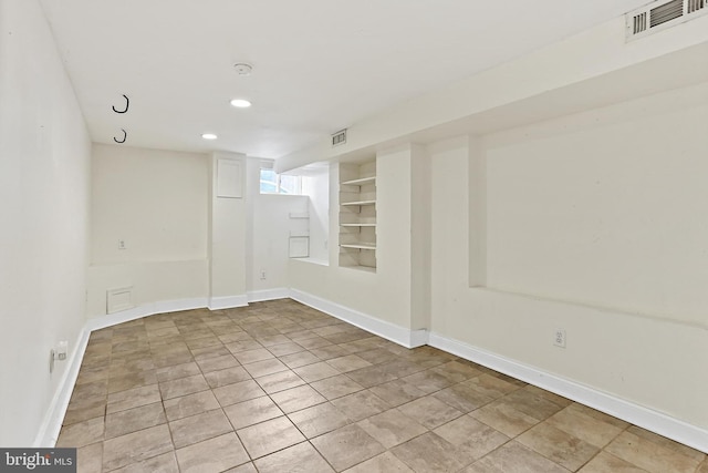 3016 Dillon St, Baltimore, MD 21224 - empty room with built in shelves, recessed lighting, and light tile patterned floors