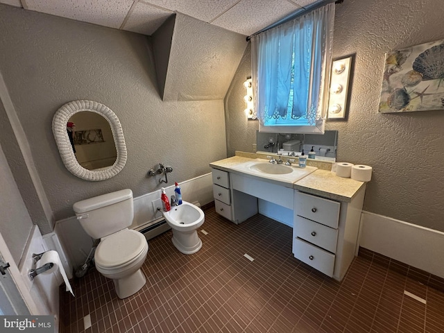2326 Franklin Ave, Morton, PA 19070 - bathroom with a bidet, a textured wall, tile patterned floors, and vanity