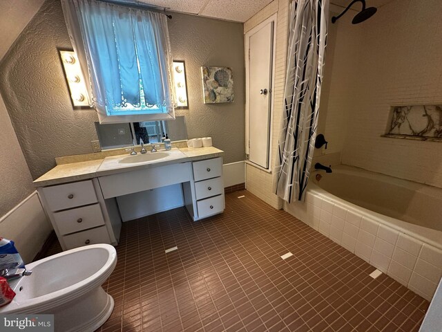 2326 Franklin Ave, Morton, PA 19070 - bathroom featuring a textured wall, tiled shower / bath, vanity, and tile patterned flooring