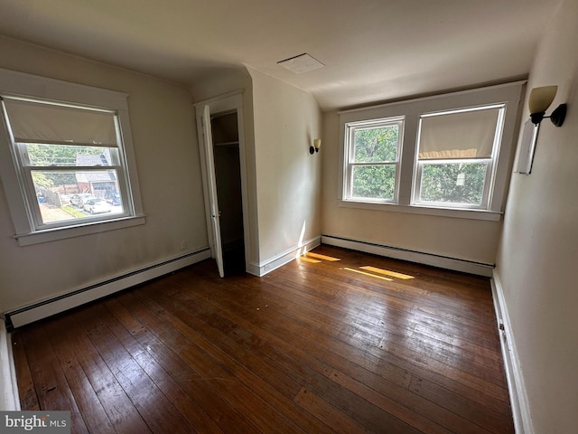 2326 Franklin Ave, Morton, PA 19070 - unfurnished bedroom featuring baseboard heating and dark wood-style flooring