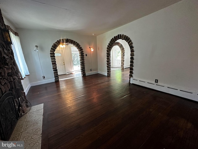2326 Franklin Ave, Morton, PA 19070 - unfurnished living room featuring arched walkways and wood finished floors