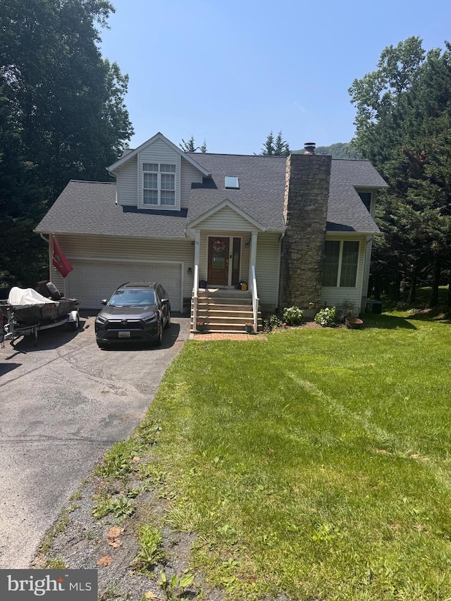 38 Diane Trl, Fairfield, PA 17320 - view of front of house featuring driveway, a shingled roof, a front yard, and a chimney
