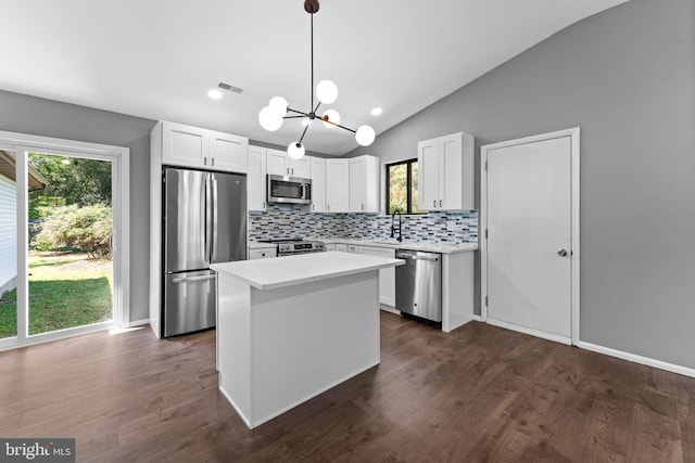 112 Beacon, Moorestown, NJ 08057 - kitchen with stainless steel appliances, decorative backsplash, a chandelier, light countertops, and vaulted ceiling