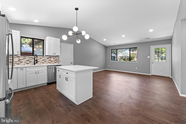 112 Beacon, Moorestown, NJ 08057 - kitchen with appliances with stainless steel finishes, decorative backsplash, light countertops, white cabinets, and dark wood finished floors