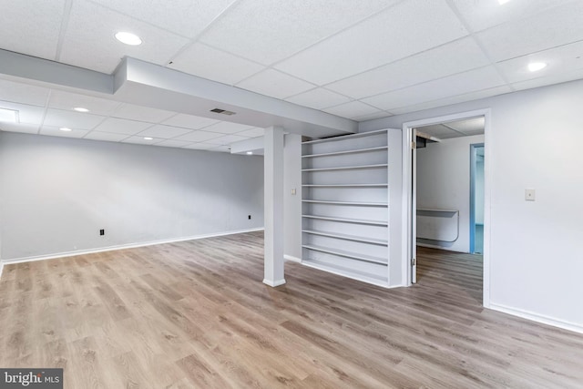 1240 Windmill Ln, Silver Spring, MD 20905 - finished basement with a drop ceiling, wood finished floors, built in shelves, and recessed lighting