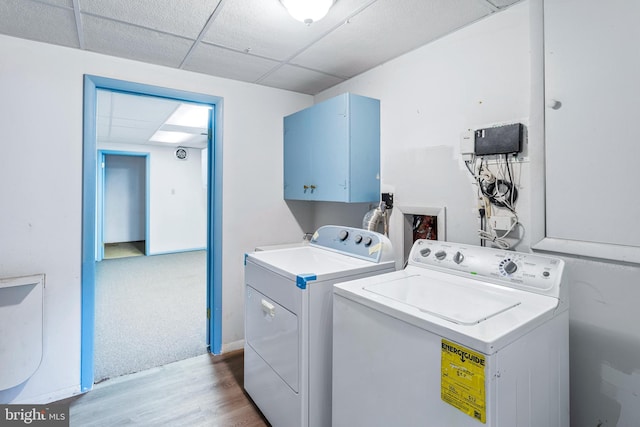 1240 Windmill Ln, Silver Spring, MD 20905 - washroom with cabinet space, washer and clothes dryer, and wood finished floors