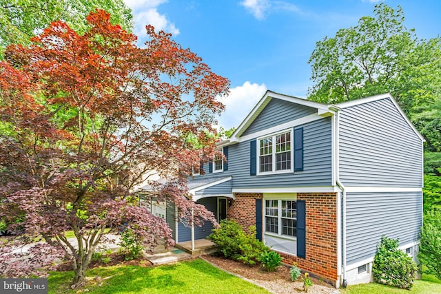 1240 Windmill Ln, Silver Spring, MD 20905 - view of front of house with a front yard and brick siding