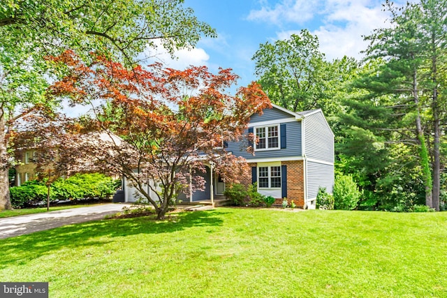 1240 Windmill Ln, Silver Spring, MD 20905 - view of front of house with driveway, brick siding, and a front yard