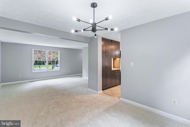 1240 Windmill Ln, Silver Spring, MD 20905 - empty room with light colored carpet, a chandelier, and a textured ceiling