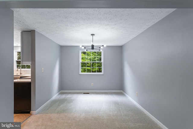 1240 Windmill Ln, Silver Spring, MD 20905 - unfurnished dining area featuring light colored carpet and a chandelier