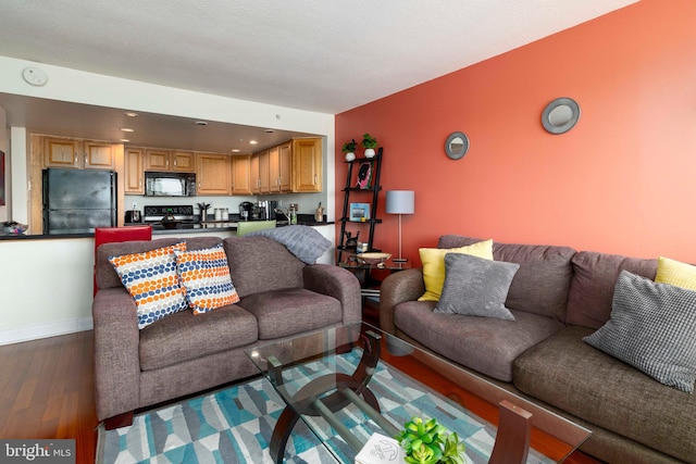 2001 Hamilton St Unit 925, Philadelphia, PA 19130 - living area featuring dark wood-type flooring and recessed lighting