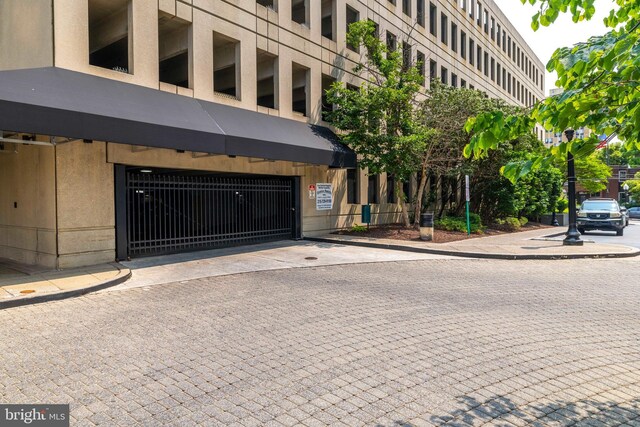2001 Hamilton St Unit 925, Philadelphia, PA 19130 - view of property featuring a garage and driveway