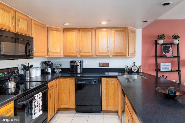 2001 Hamilton St Unit 925, Philadelphia, PA 19130 - kitchen with black appliances, light tile patterned flooring, recessed lighting, and dark countertops