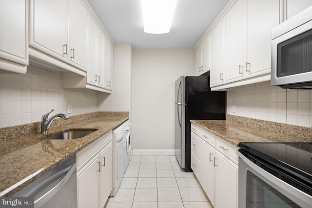 1901 John F Kennedy Blvd Unit 1414, Philadelphia, PA 19103 - kitchen with appliances with stainless steel finishes, tasteful backsplash, and white cabinets