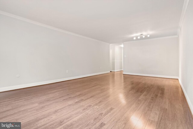 1901 John F Kennedy Blvd Unit 1414, Philadelphia, PA 19103 - spare room featuring crown molding, light wood-style floors, and rail lighting