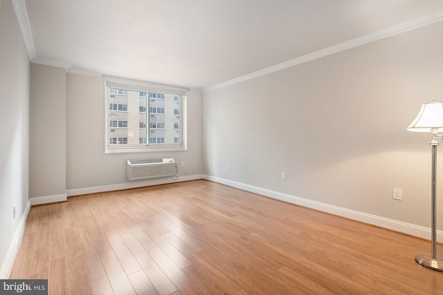 1901 John F Kennedy Blvd Unit 1414, Philadelphia, PA 19103 - unfurnished room with a wall mounted AC, ornamental molding, and light wood-type flooring