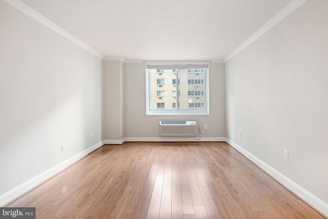 1901 John F Kennedy Blvd Unit 1414, Philadelphia, PA 19103 - unfurnished room featuring a wall mounted air conditioner, crown molding, and light wood-type flooring