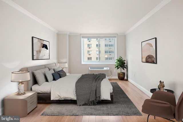1901 John F Kennedy Blvd Unit 1414, Philadelphia, PA 19103 - bedroom featuring ornamental molding, a wall mounted AC, and light wood-style flooring