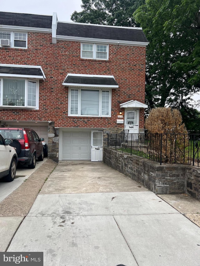 9013 Ashton Rd, Philadelphia, PA 19136 - view of property featuring concrete driveway, a garage, and brick siding