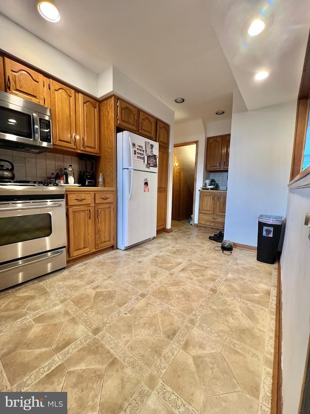 9013 Ashton Rd, Philadelphia, PA 19136 - kitchen featuring appliances with stainless steel finishes, backsplash, recessed lighting, and brown cabinets