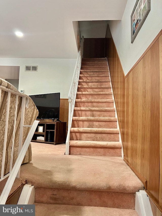 9013 Ashton Rd, Philadelphia, PA 19136 - stairs with carpet and wood walls
