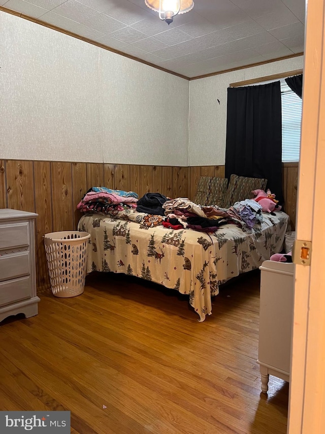 9013 Ashton Rd, Philadelphia, PA 19136 - bedroom with wood finished floors, wooden walls, and crown molding