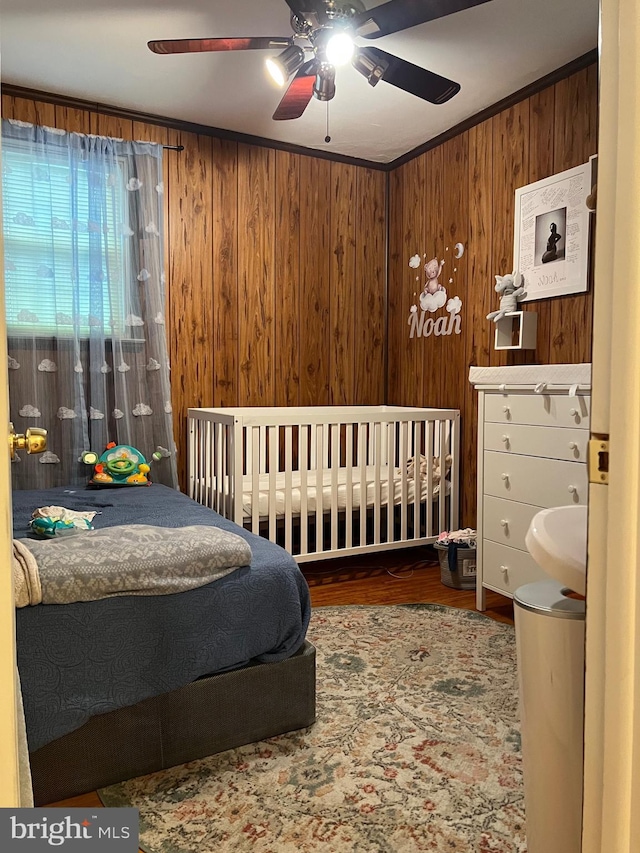 9013 Ashton Rd, Philadelphia, PA 19136 - bedroom with wood walls, wood finished floors, and a ceiling fan