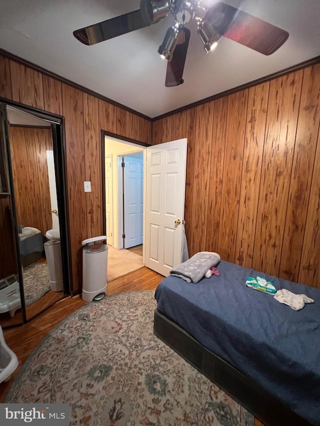 9013 Ashton Rd, Philadelphia, PA 19136 - bedroom featuring wood walls, wood finished floors, ceiling fan, and ornamental molding