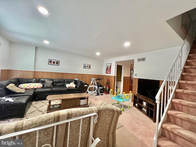 9013 Ashton Rd, Philadelphia, PA 19136 - living area with a wainscoted wall, carpet flooring, stairway, wooden walls, and recessed lighting