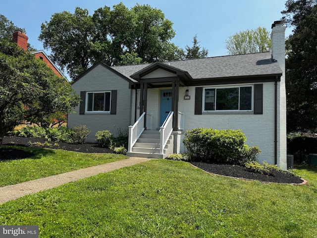 6232 18th Rd N, Arlington, VA 22205 - view of front of property with brick siding, a front yard, a chimney, and a shingled roof