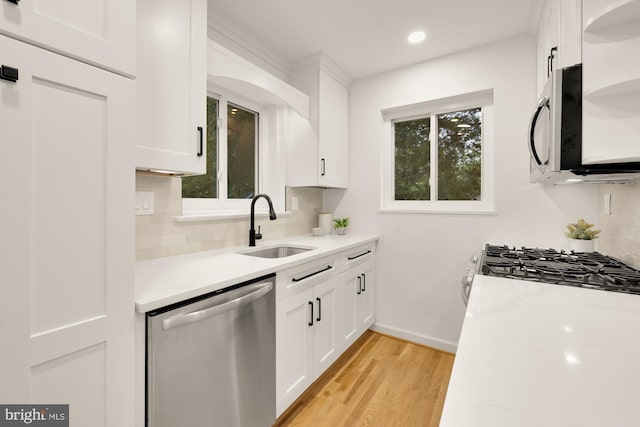 6232 18th Rd N, Arlington, VA 22205 - kitchen featuring stainless steel appliances, light countertops, white cabinets, decorative backsplash, and recessed lighting