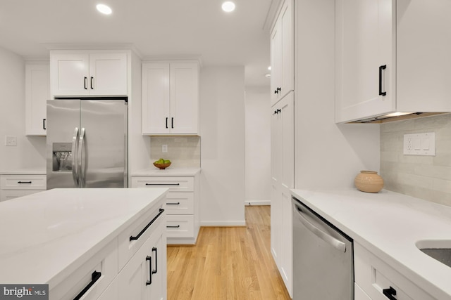 6232 18th Rd N, Arlington, VA 22205 - kitchen with appliances with stainless steel finishes, recessed lighting, backsplash, white cabinetry, and light wood-style floors