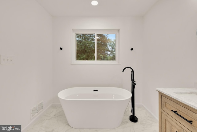 6232 18th Rd N, Arlington, VA 22205 - bathroom featuring marble finish floors, a freestanding bath, vanity, and recessed lighting