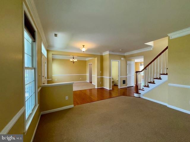 12410 Coastal Marsh Dr, Berlin, MD 21811 - foyer with carpet floors, a chandelier, crown molding, and stairs