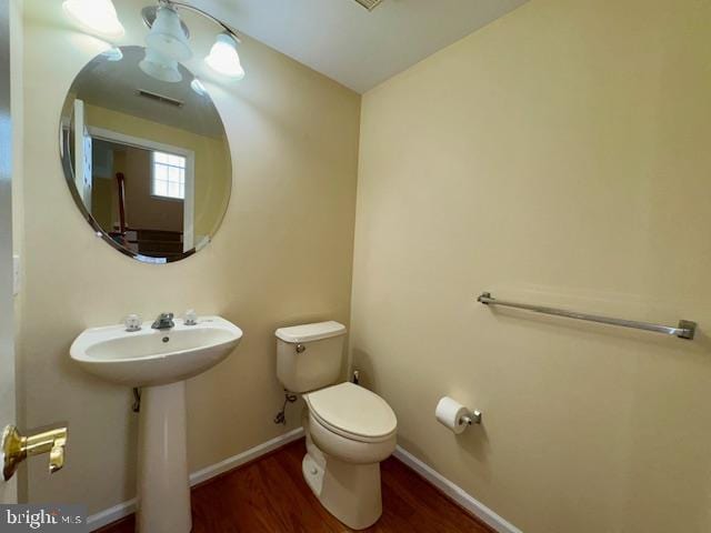 12410 Coastal Marsh Dr, Berlin, MD 21811 - half bath with toilet and wood finished floors