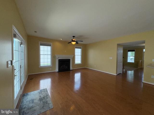 12410 Coastal Marsh Dr, Berlin, MD 21811 - unfurnished living room with a ceiling fan, wood finished floors, and a fireplace with flush hearth